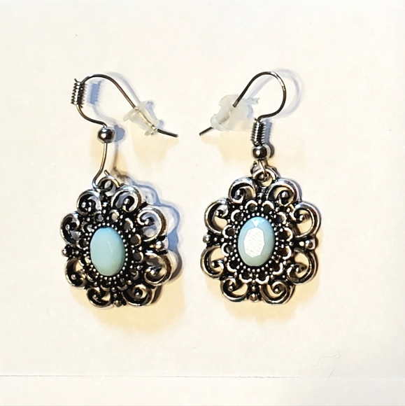 Paparazzi light aqua milky stone silver earrings.